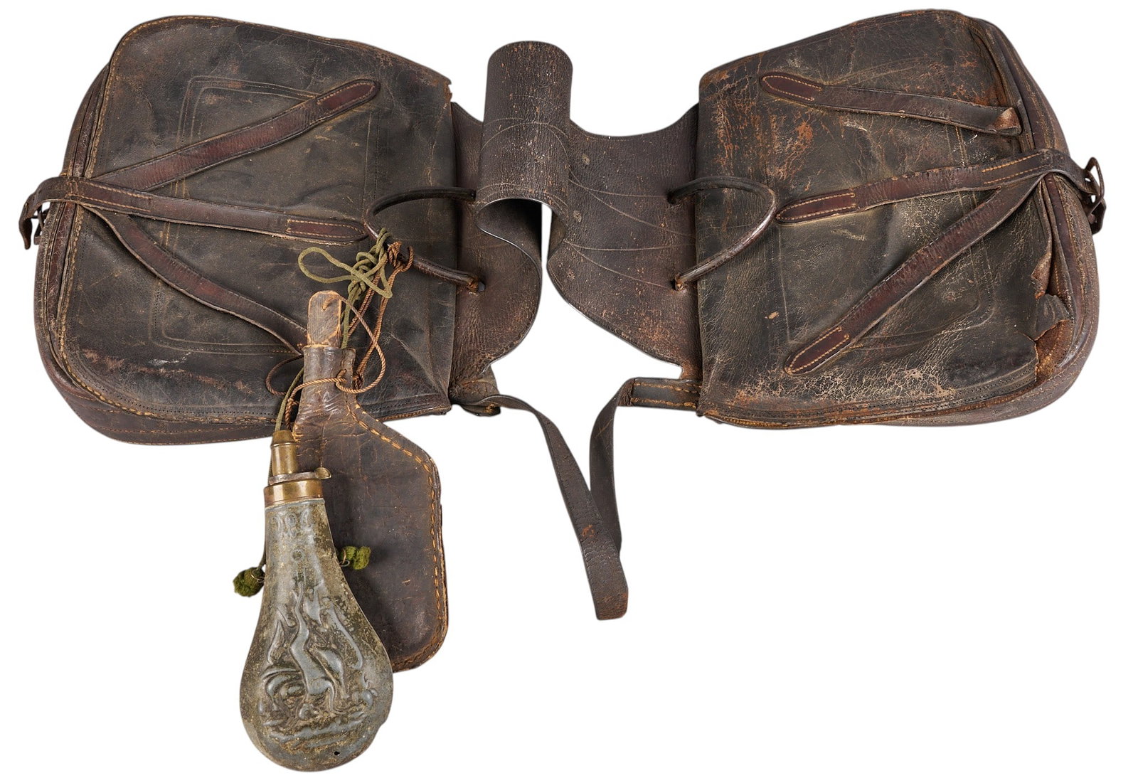 Red McCombs | Pair of Antique Saddlebags: Pair of antique embossed and stitched black leather saddle bags with powder flask and shot pouch attached, circa mid-19th century height 20 in. x width 13.5 in. x depth 39 in. Pro