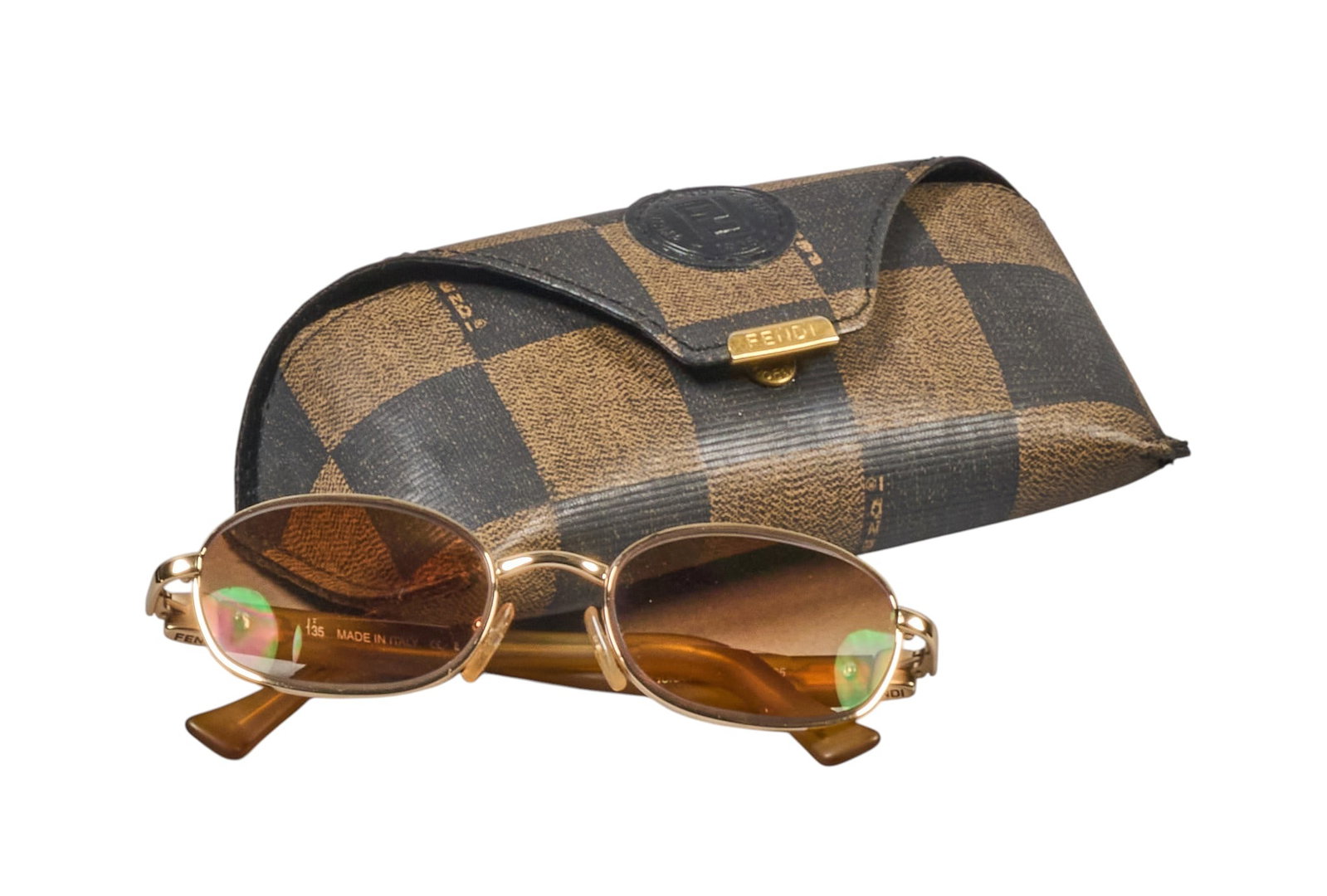 Red McCombs | Pair of Vintage Fendi FS266 Sunglasses: Pair of vintage Fendi model FS266 sunglasses with "golden glimmer" palladium frame and orange-tinted lenses, includes original Fendi leather case 135 mm Temple Length length 7 in. x wi