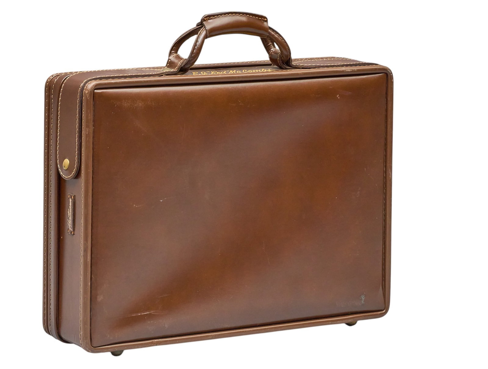 Red McCombs | Hartman Customized Leather Briefcase: Red McCombs Hartman customized brown leather briefcase, with gold embossed "B.J. "Red" McCombs" under handle height 16.5 in. x width 18 in. x depth 5 in. Condition A; e