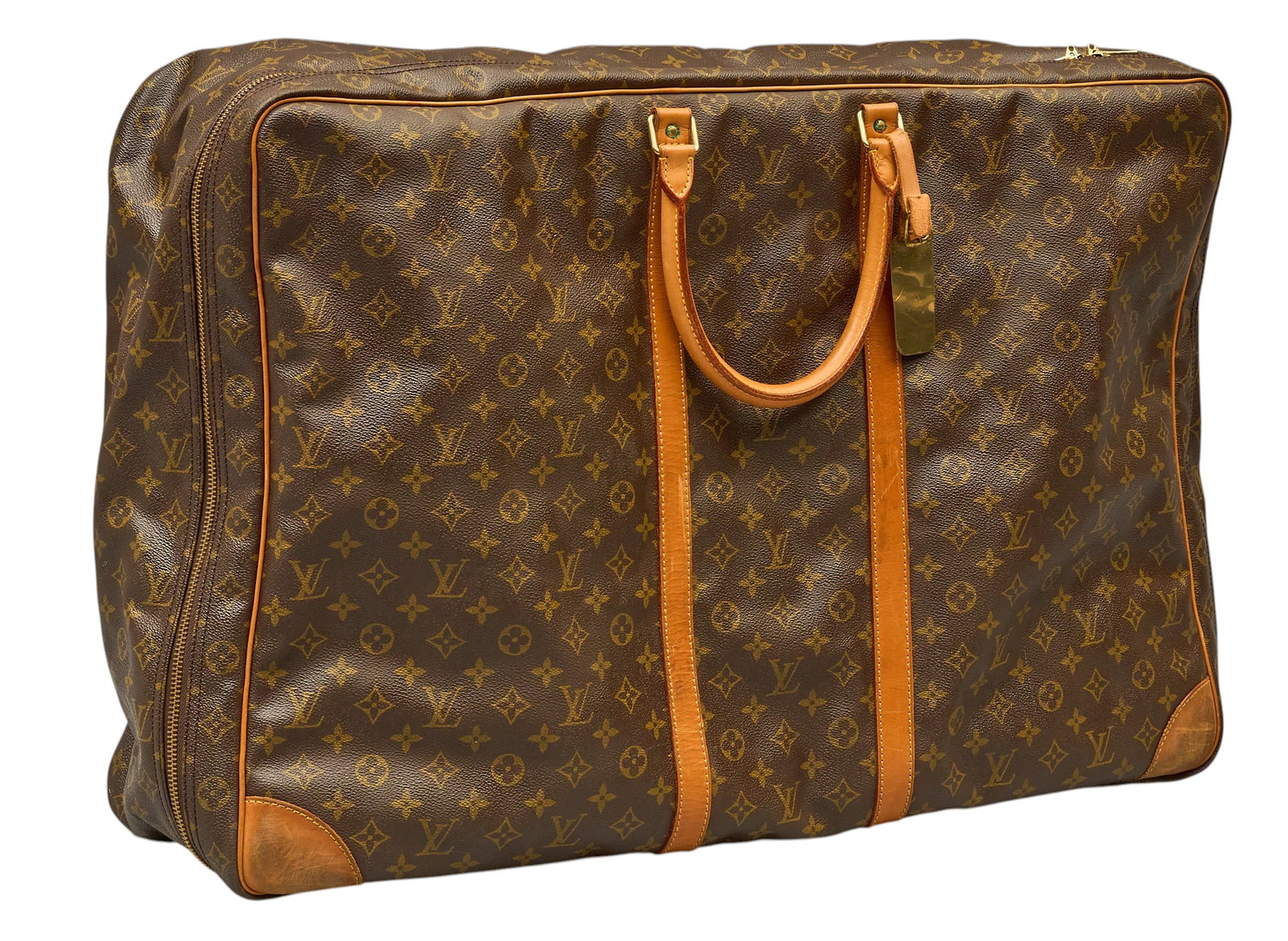 Red McCombs | Louis Vuitton Sirius Soft Suitcase: Louis Vuitton Sirius soft suitcase, with brown monogram canvas, vachetta bands and handles, includes brass "Mr. and Mrs. Red McCombs" tag height 24 in. x width 32 in. x depth 8