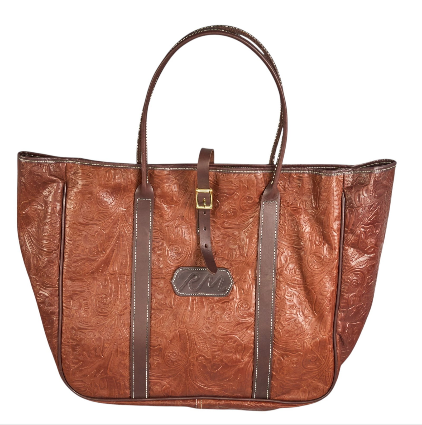 Red McCombs | Tooled Leather Shoulder Bag: Leather shoulder bag with brown leather handles, customized with McCombs Ranches brand, decorated with tooled paisley pattern height 28 in. x width 25 in. x depth 7 in. Condition A; excelle