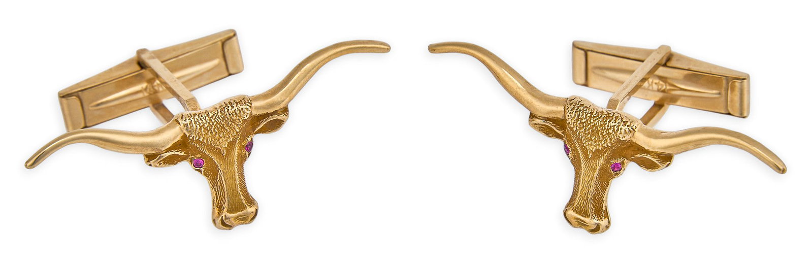 Red McCombs | 14K Ruby Longhorn Cufflinks: Pair of finely sculpted 14K gold longhorn head cufflinks, set with faceted ruby accents and swivel toggle backs, marked "14KT" Size: 1.5 in. x 0.5 in. Total weight: 10.1 g