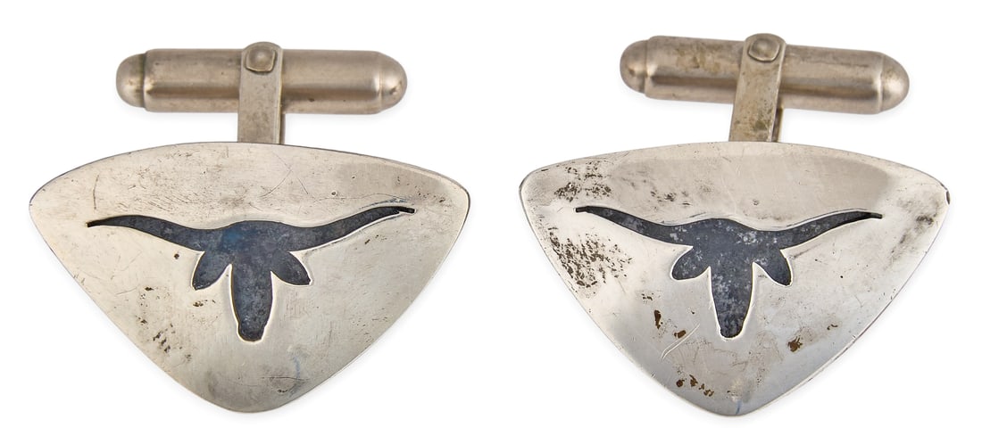Red McCombs | Texas Longhorn Sterling Silver Cufflinks: Pair of sterling silver cufflinks by Rogers, featuring cut-out longhorn silhouette, with swivel toggle backs, marked "Rogers Sterling" Size: 1 in. x 5/8 in. Total weight: 10.9 g