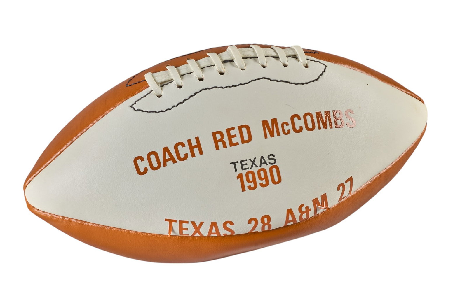 Red McCombs | Coach Red McCombs 1990 Commemorative Football: Coach Red McCombs commemorative football, for 1990 University of Texas victory over Texas A&M height 6.5 in. x width 16.5 in. Provenance: Property from the personal esta