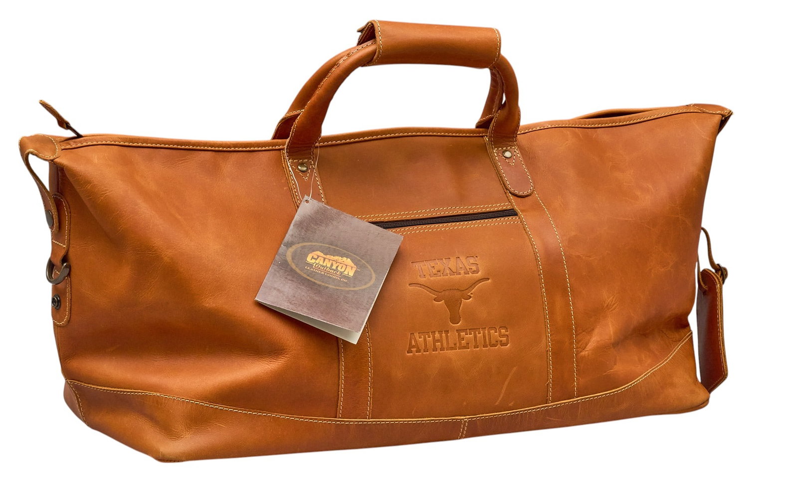 Red McCombs | Canyon Outback UT Texas Athletics Custom Leather Duffle: Canyon Outback UT Texas Athletics custom leather duffle, with heat-embossed Texas Longhorns silhouette on front, McCombs embroidered on interior lining height 11 in. x width 27 in. x d