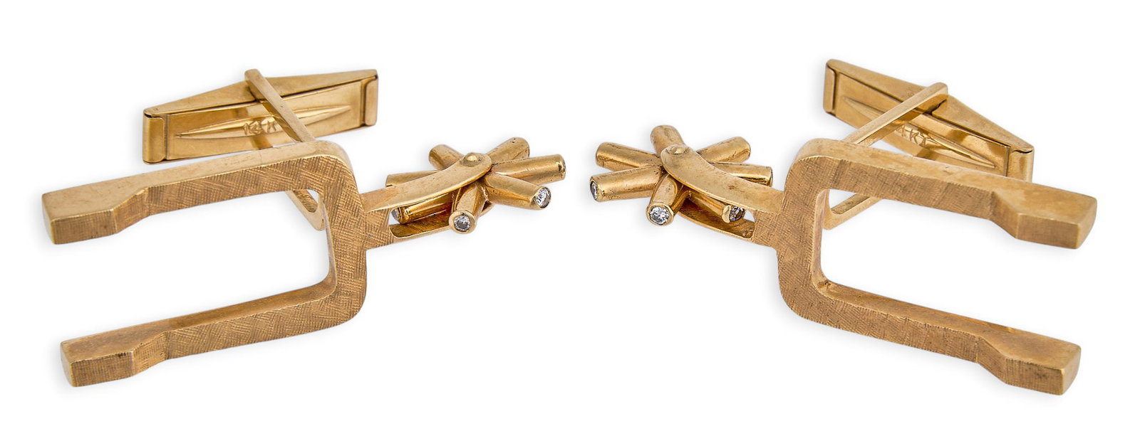 Red McCombs | 14K Spur Cufflinks: Pair of 14K gold cufflinks depicting spurs, with Florentine finish, moveable rowels, and toggle backs, marked "14K" Size: 1.5 in. x 0.5 in. / each Total weight: 15.7g