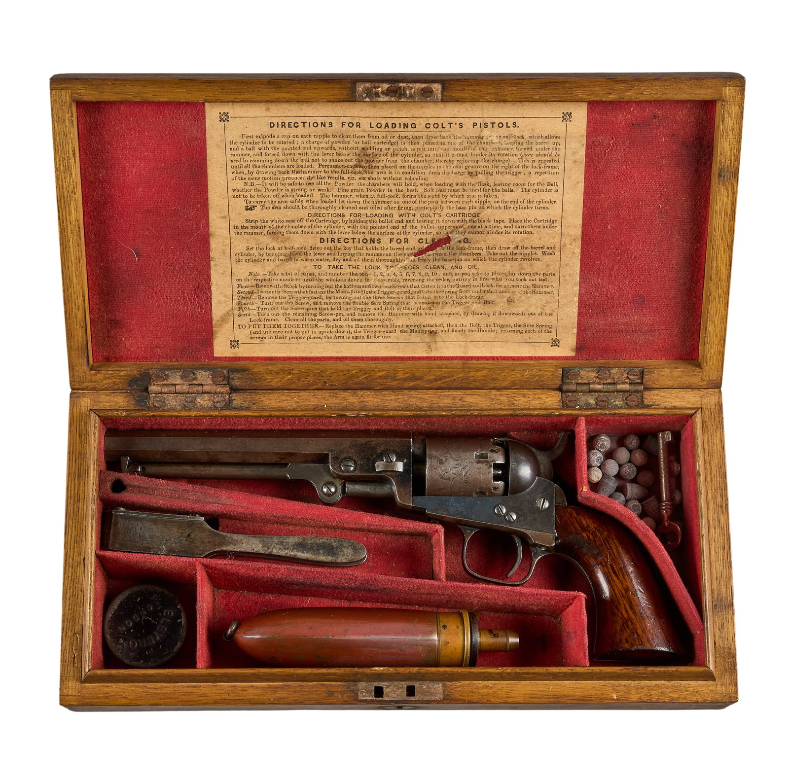 Red McCombs | Cased First Year Colt London Model 1849 Pocket Revolver W/ Accoutrements: Serial: 1638 Manufacturer: Colt-London (c. 1853) Model: London 1849 Pocket Caliber: 31 cal. OAL: 11 in. Condition: Very good-antique; traces of bluing remain on barrel & frame with gray/brow