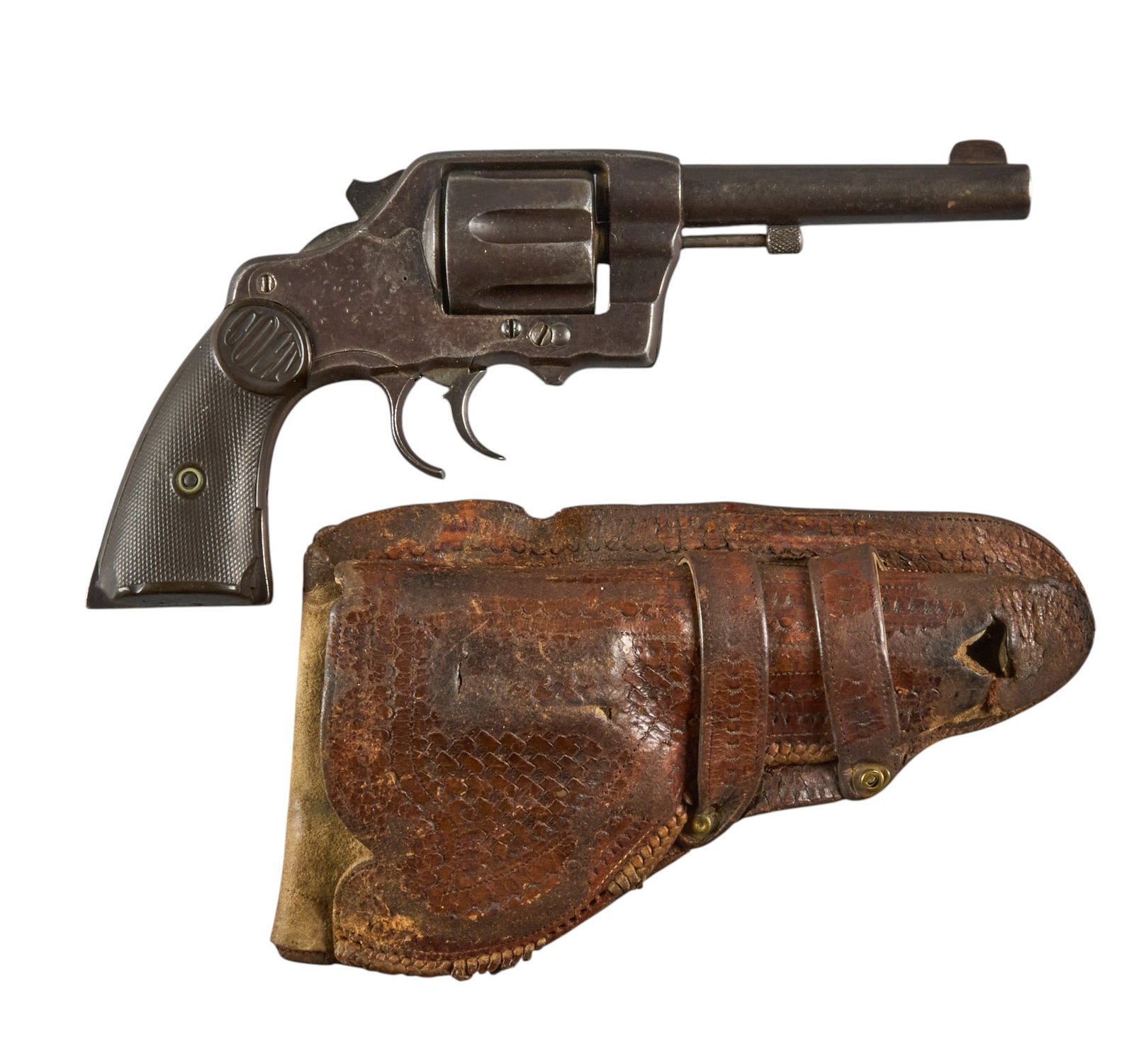 Red McCombs | Antique Colt New Army DA 38 Revolver W/ Modified Hammer & Trigger Guard: Serial: 24949 Manufacturer: Colt's PT. F.A. Mfg. Co. (c. 1895) Model: DA 38 Caliber: 38 Special Barrel Length: 4.5 in. OAL: 9.75 in. Condition: Fair/good-antique; worn checkering, chunks missing f