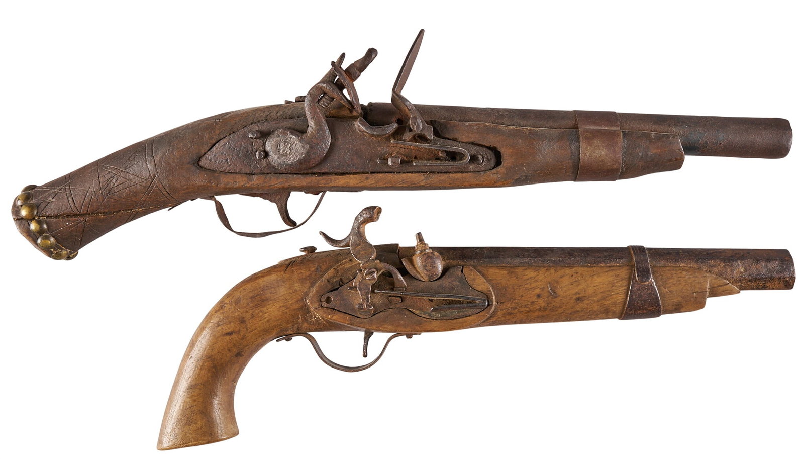 Red McCombs | Pair of Flintlock Pistols; Indo-Persian & American Indian: Model: Flintlock Pistol Caliber: (1) 71; (2) 78 Approx. Condition: Poor-antique; heavily worn, heavy rust & pitting Provenance: Property from the personal estate collection of iconic Texas busines
