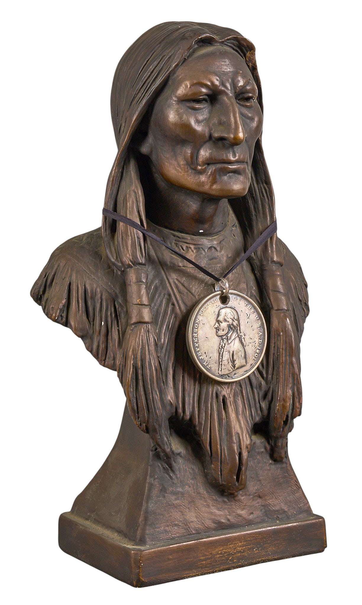 Red McCombs | Chalkware Native American Bust with Medal: Chalkware bust depicting Native American wearing peace medal, stamped Marwal and Inc. height 17.5 in. x width 10 in. x depth 6 in. Provenance: Property from the personal estate collection o
