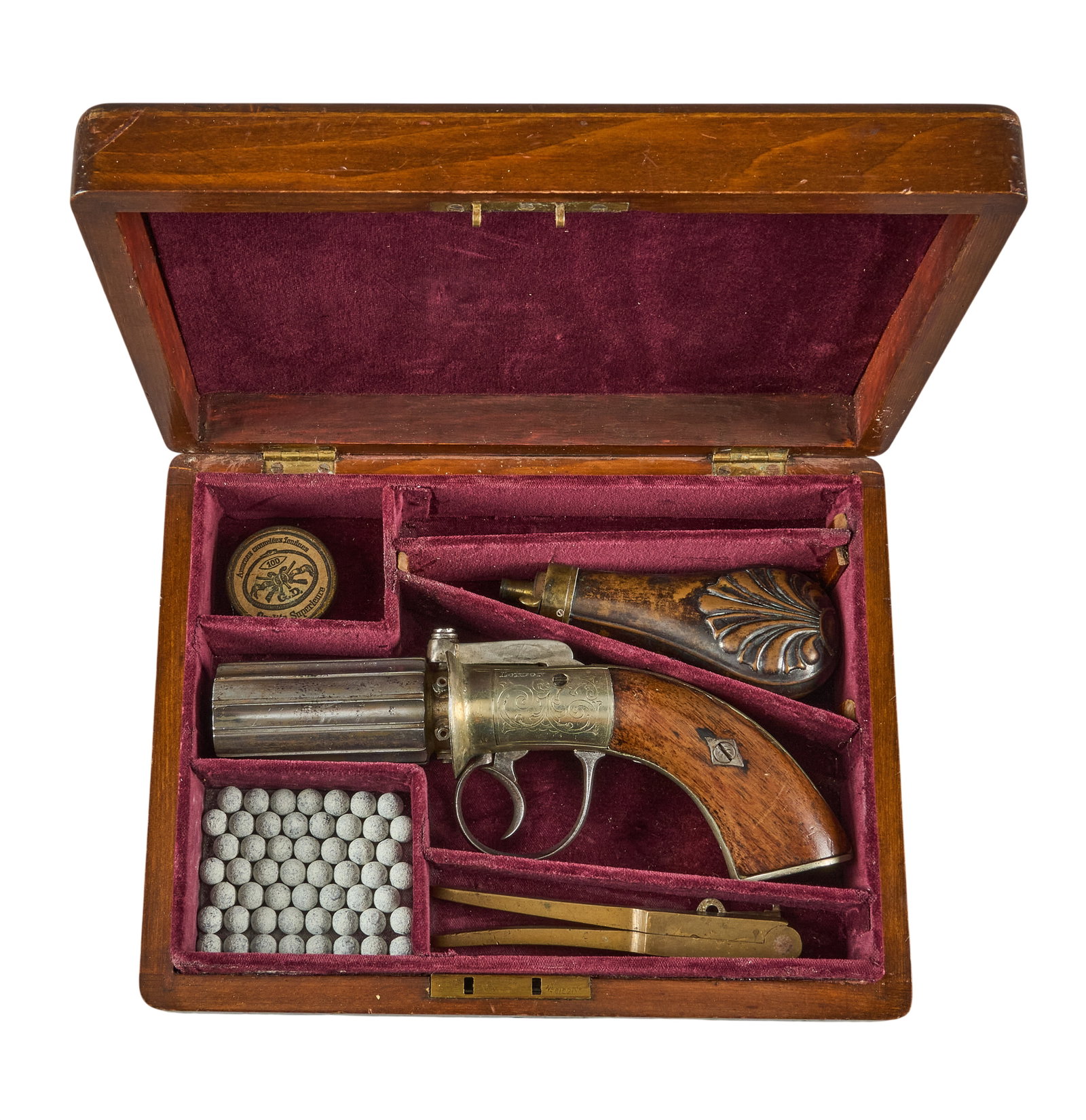 Red McCombs | Cased James Beattie London Pepperbox Pistol W/ Accoutrements: Manufacturer: James Beattie-London, England (c. mid-19th c.) Model: Pepperbox pistol Caliber: 31 cal. Barrel Length: 2.75 in. OAL: 8 in. Condition: Good-antique; wood grips have moderate wear frame