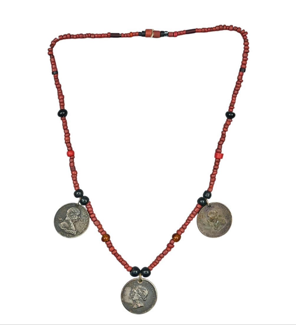 Red McCombs | Padres Medallion Necklace: Beaded string of antique padre medallions, historically given to American Indian converts, circa 19th century length 13 in. Provenance: Property from the personal estate collection of iconic Tex