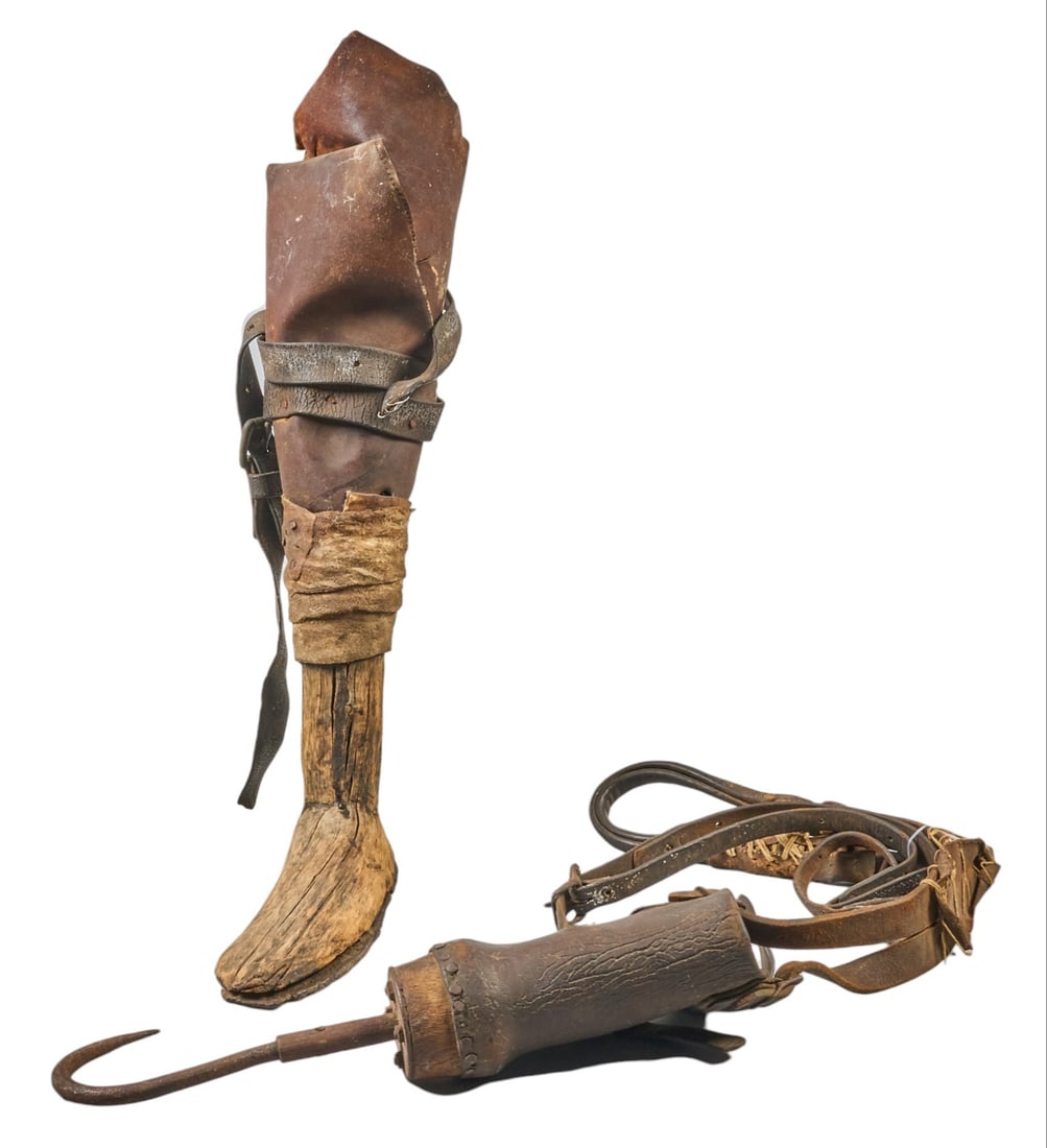 Red McCombs | Antique Prothesis Leg and Hook Hand: Antique prosthetic leg is carved from mesquite, believed to belong to a Mexican soldier who lost a limb in the battle of the Alamo while serving under Santa Anna, and antique prosthetic iron hook