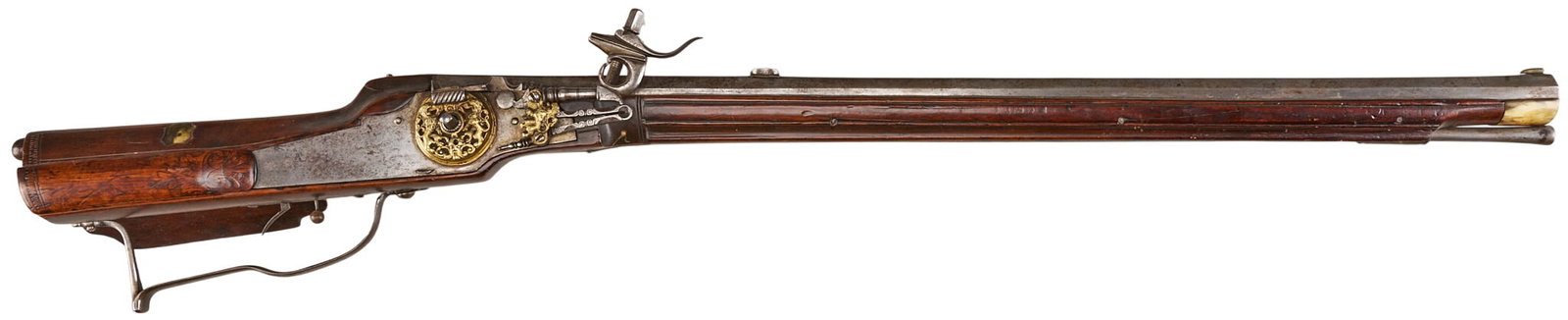 Red McCombs | 17th Century Brass Embellished South German Wheellock Rifle: Manufacturer: South German (c. late 1600s-early 1700s) Model: wheellock hunting rifle Caliber: 68 cal. Barrel Length: 30 in. OAL: 41.5 in. Condition: Very good-antique; wood stock is in good condition