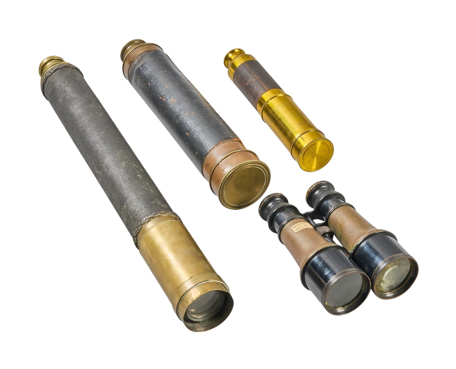 Red McCombs | (4) Optical Instruments: Collection of four antique optical instruments featuring three brass, leather-wrapped spyglasses, and a pair of marine binoculars, circa 19th-to-20th century length 21 in. x diameter 3 in. / largest P