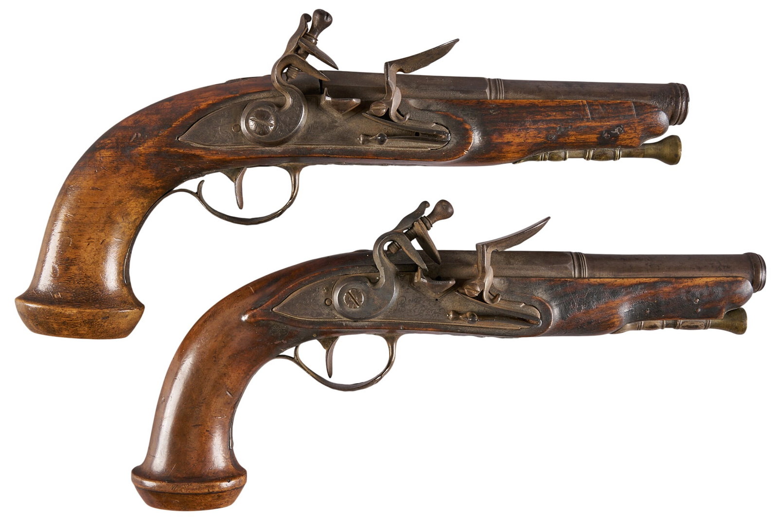 Red McCombs | Pair of French Veyron Silver-Mounted Flintlock Pistols: Model: French Flintlock Dueling Pistol Caliber: 50 OAL: 10.5 in. Condition: Good-antique; moderate wear on wood stocks; barrels & lock plates have gray/brown patina with light pitting; both mechan
