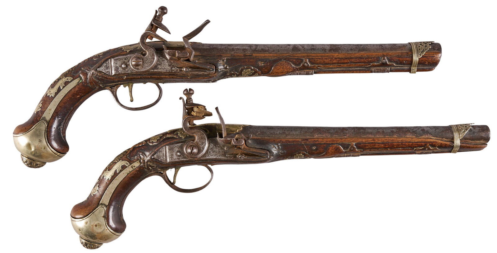 Red McCombs | Pair of Silver-Mounted Flintlock Pistols: Model: French Style Flintlock Pistol Caliber: 64 OAL: 18.5 in. Condition: Fair-antique; extensive wear, rust & pitting throughout; mechanical issues Includes: extensive German Silver mounting