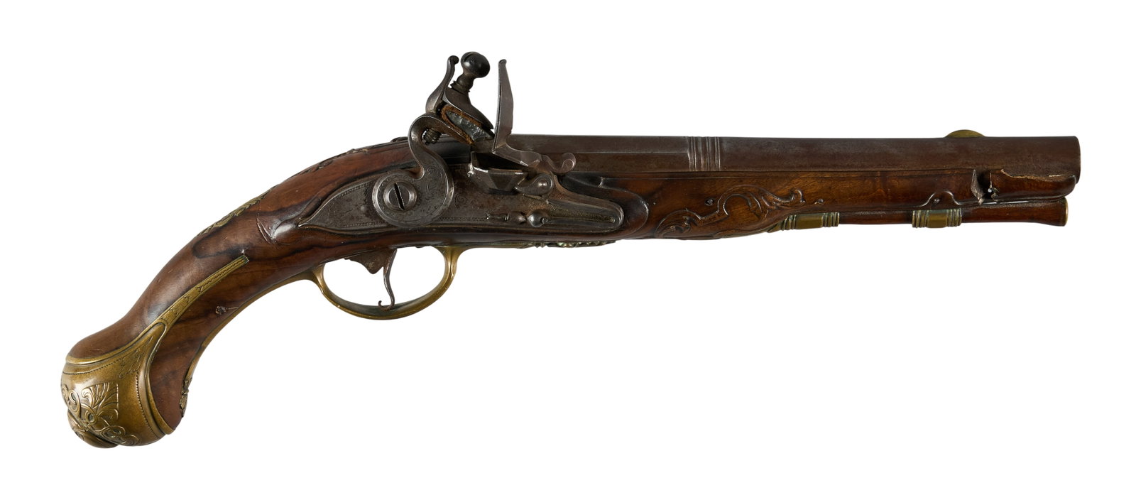Red McCombs | European Carved & Brass Mounted Flintlock Pistol: Model: Flintlock Pistol Caliber: 60 OAL: 15.5 in. Condition: Good-antique; moderate wear & scattered pitting; break in forearm; mechanically functional Includes: pierced & engraved brass mount