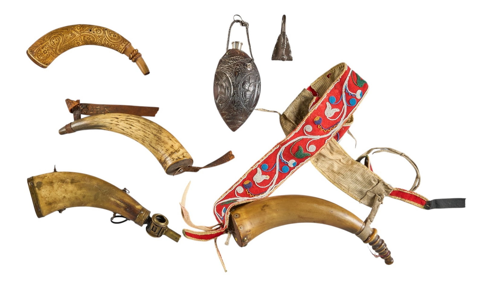 Red McCombs | (6) Antique Powder Horns: Collection of 18th and 19th century powder horns, with various designs, and accents, including one carved coconut, one with brass tip, one with scrimshaw art decoration, and one with decoratively bead