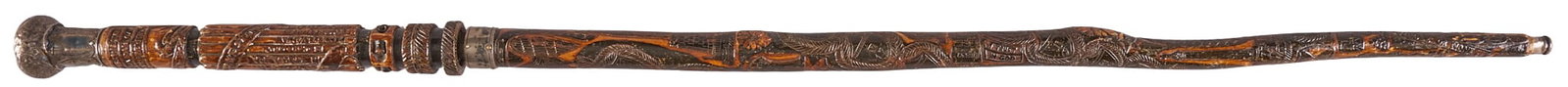Red McCombs | Carved & Silver Mounted Mexican-American War Sword Cane: Heavily carved Mexican-Amrican War commemorative cane sword with silver moutning OAL: 36 in. Good condition commensurate with age Provenance: Property from the personal estate collection of iconi