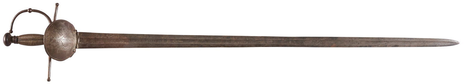 Red McCombs | 18th Century Spanish Sword: 18th century Spanish broad sword; mottos inscribed on either of blade OAL: 42.5 in. condition commensurate with age; dark patina & scattered pitting; chips along edge of blade Provenance: Property