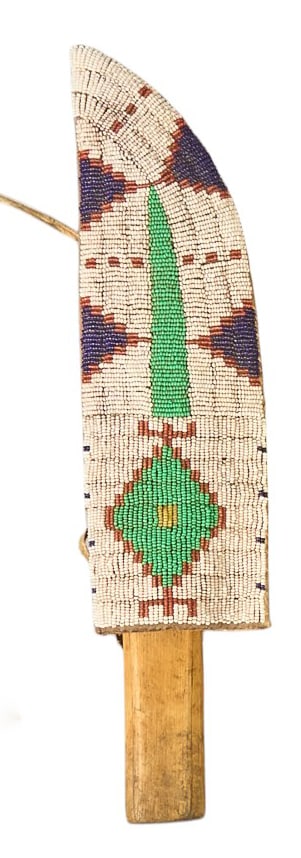 Red McCombs | Antique Utility Knife: Antique utility knife featuring wooden handle with metal rivets, housed in buckskin sheath with hand-beaded decoration overall length 13.25 in. length 11 in. x width 3 in. Provenance: Property from th