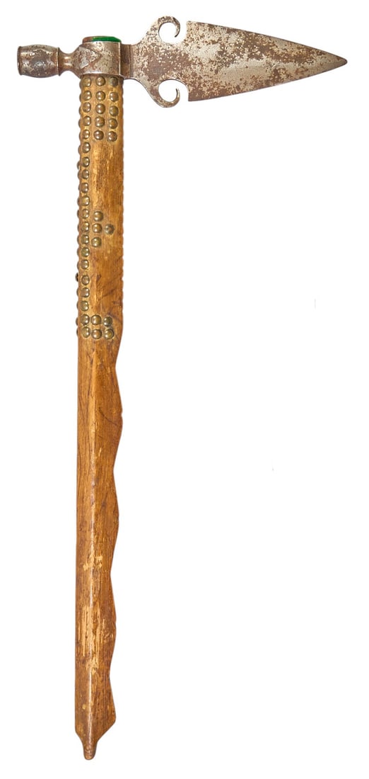 Red McCombs | Antique Spontoon Tomahawk Pipe: Antique spontoon style tomahawk pipe, likely Kiowa, with oxidized iron blade, and wooden shaft decorated with metal tacks length 25.5 in. x width 11.5 in. x depth 1.5 in. Provenance: Property from the