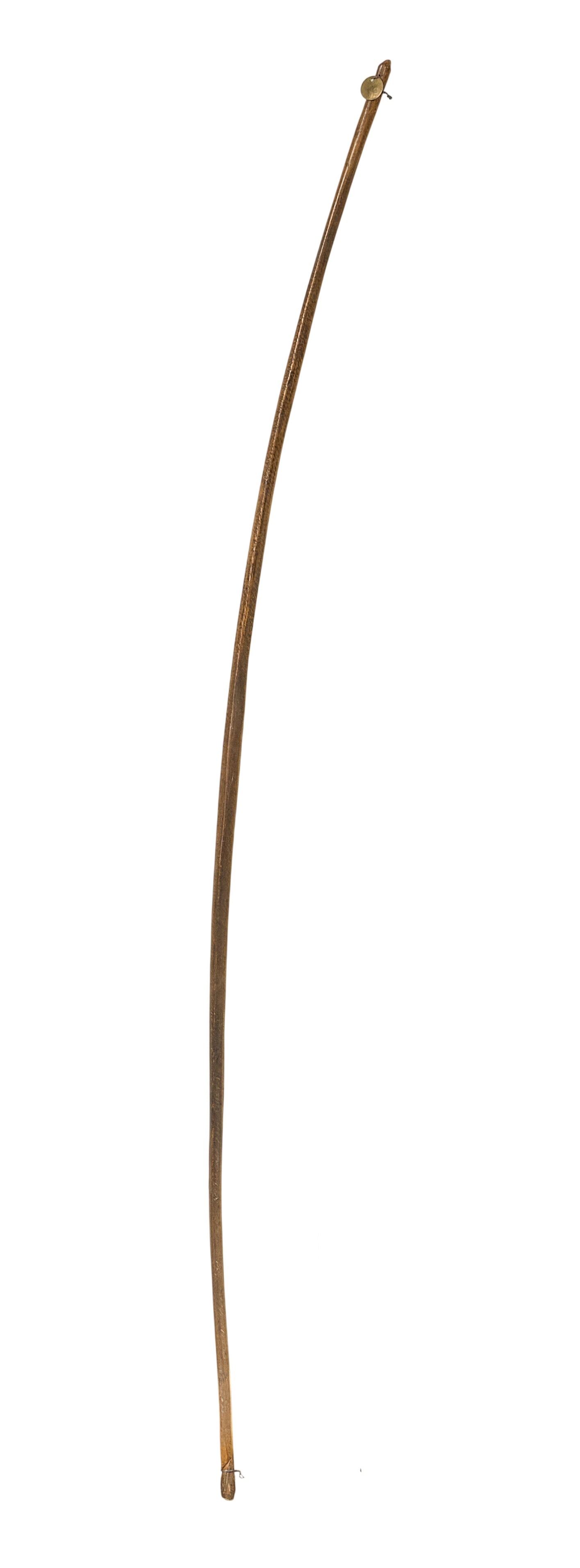 Red McCombs | Primitive Bow: Primitive wooden bow, featuring small token marked "94" on end length 64.5 in. x depth 1.5 in. Provenance: Property from the personal estate collection of iconic Texas businessman, civic leader and ph