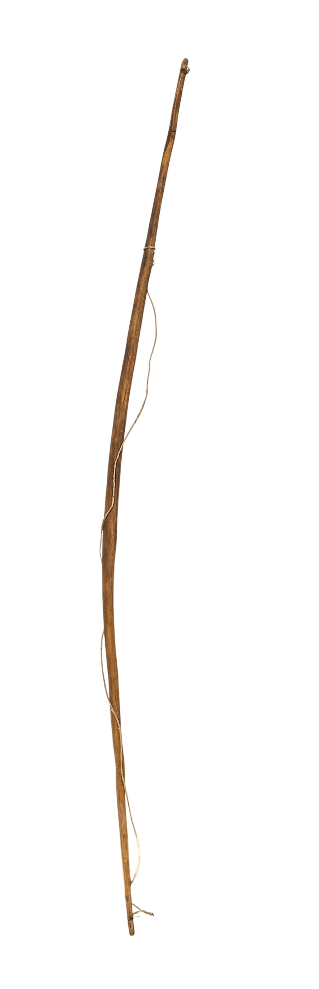 Red McCombs | Primitive Bow: Primitive wooden bow with string length 51 in. x width 1.5 in. Provenance: Property from the personal estate collection of iconic Texas businessman, civic leader and philanthropist Billy Joe Red