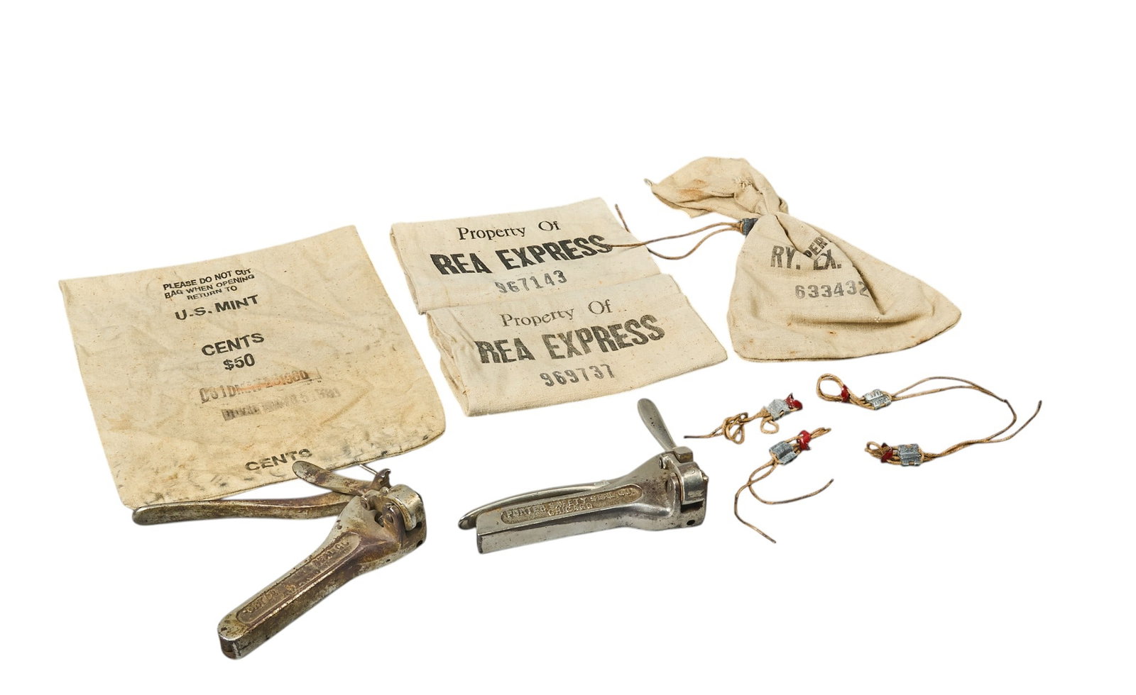 Red McCombs | Railway Express Carrier Bags and Tools: Collection of Railway Express four carrier bags for correspondence, currency or ore samples, two iron crimps, with one marked "patented Jun
