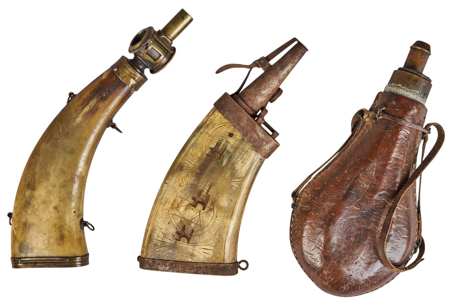 Red McCombs | (3) Antique Powder Horns: Three antique powder horns, includes one flattened horn decorated with motif featuring centaur fighting a lion, one leather wrapped example with strap, and one flask with brass nozzle lengt