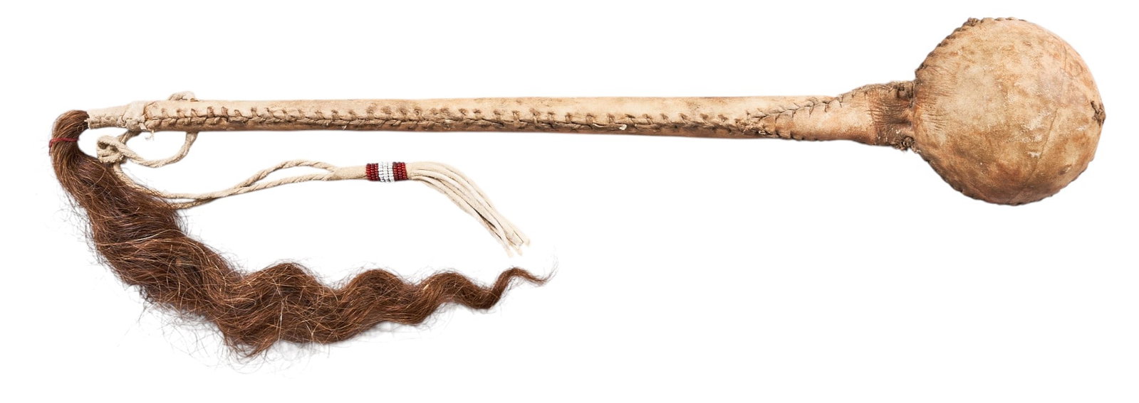 Red McCombs | Late 1800s Plains Ceremonial Dance Club: Native American hide-wrapped plains ceremonial dance club with animal hair tassel, circa late 1800s length 17 in. x width 3 in. x depth 3 in. Provenance: Property from the personal estate collection o