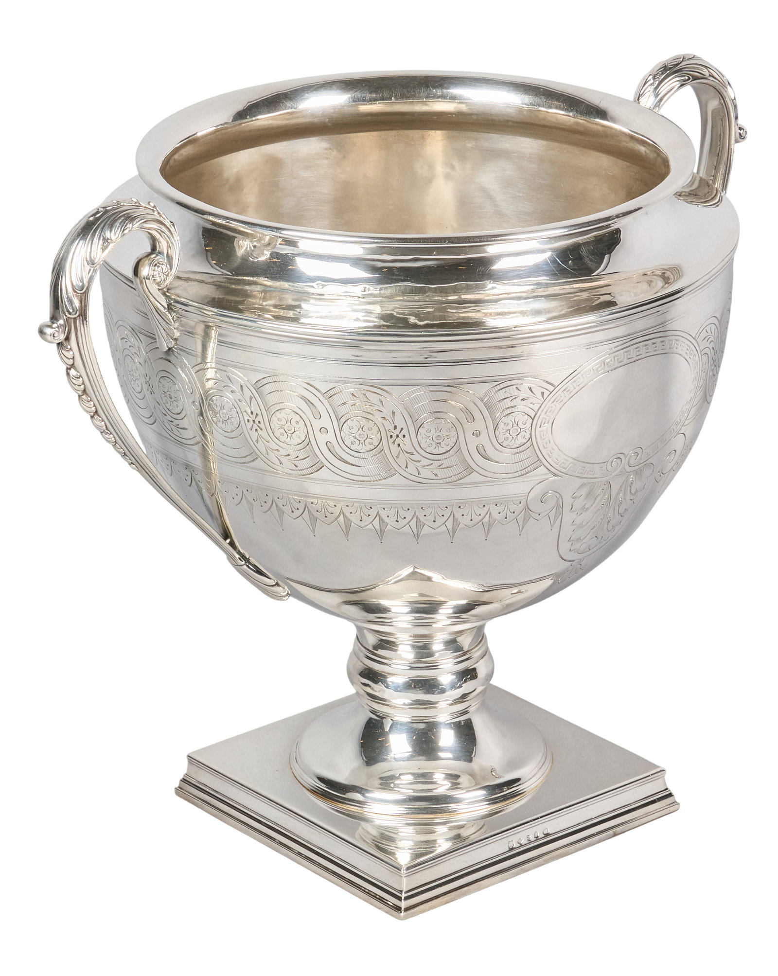 Red McCombs | Large Victorian English Silverplate Center Bowl: Large Victorian English silverplate centerpiece bowl by Thomas Harwood & Sons, Birmingham, 1865-1892, with repoussé handles, engraved blank cartouche, raised on square pedestal base height 