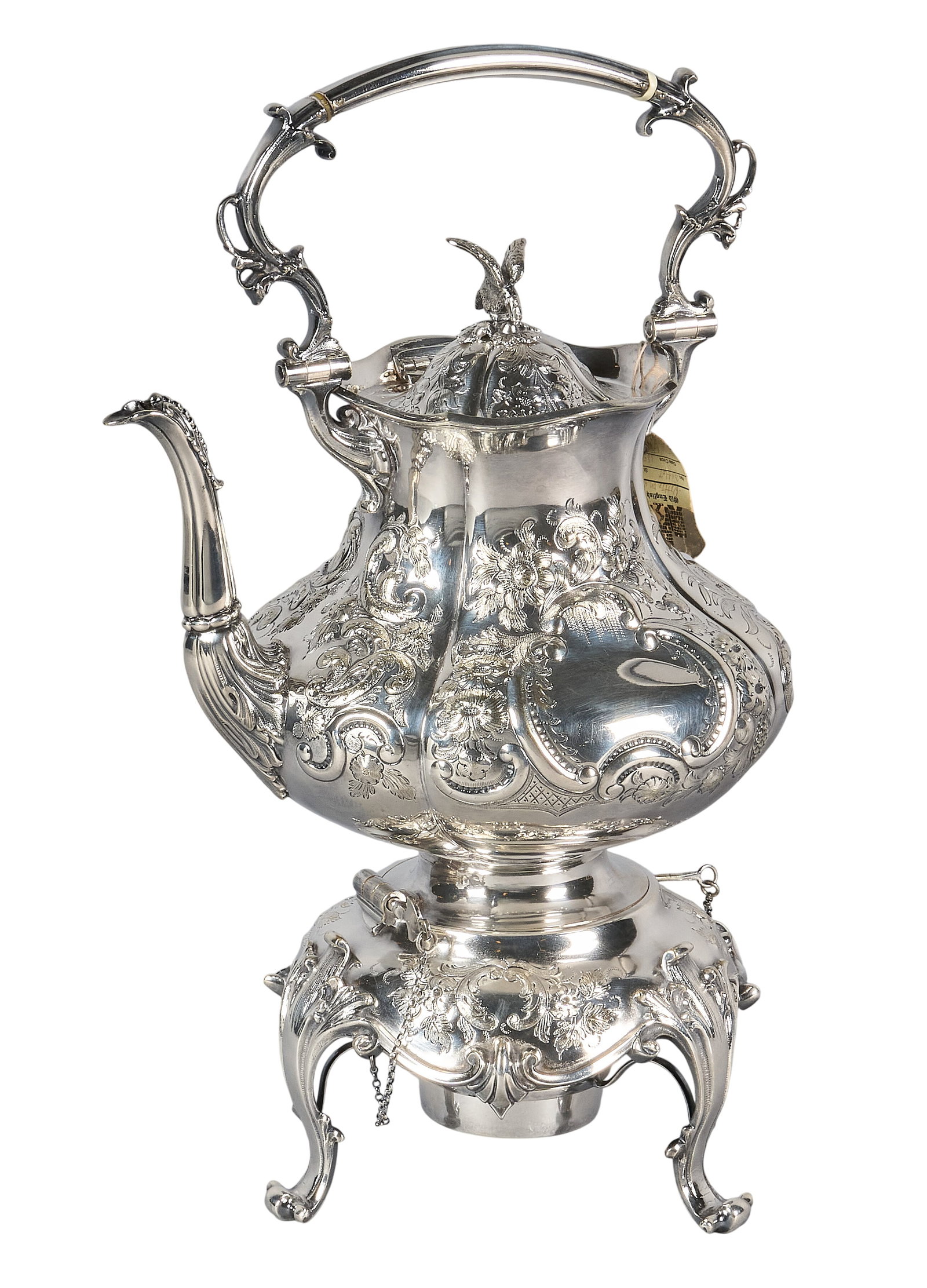 Red McCombs | Victorian Silverplate Kettle on Stand: Victorian English silverplate kettle on stand, featuring hinged domed lid with bird finial, foliate repousse design, raised on scrolled feet, circa 1850 height 17 in. x width 10.5 in. x depth 8.5