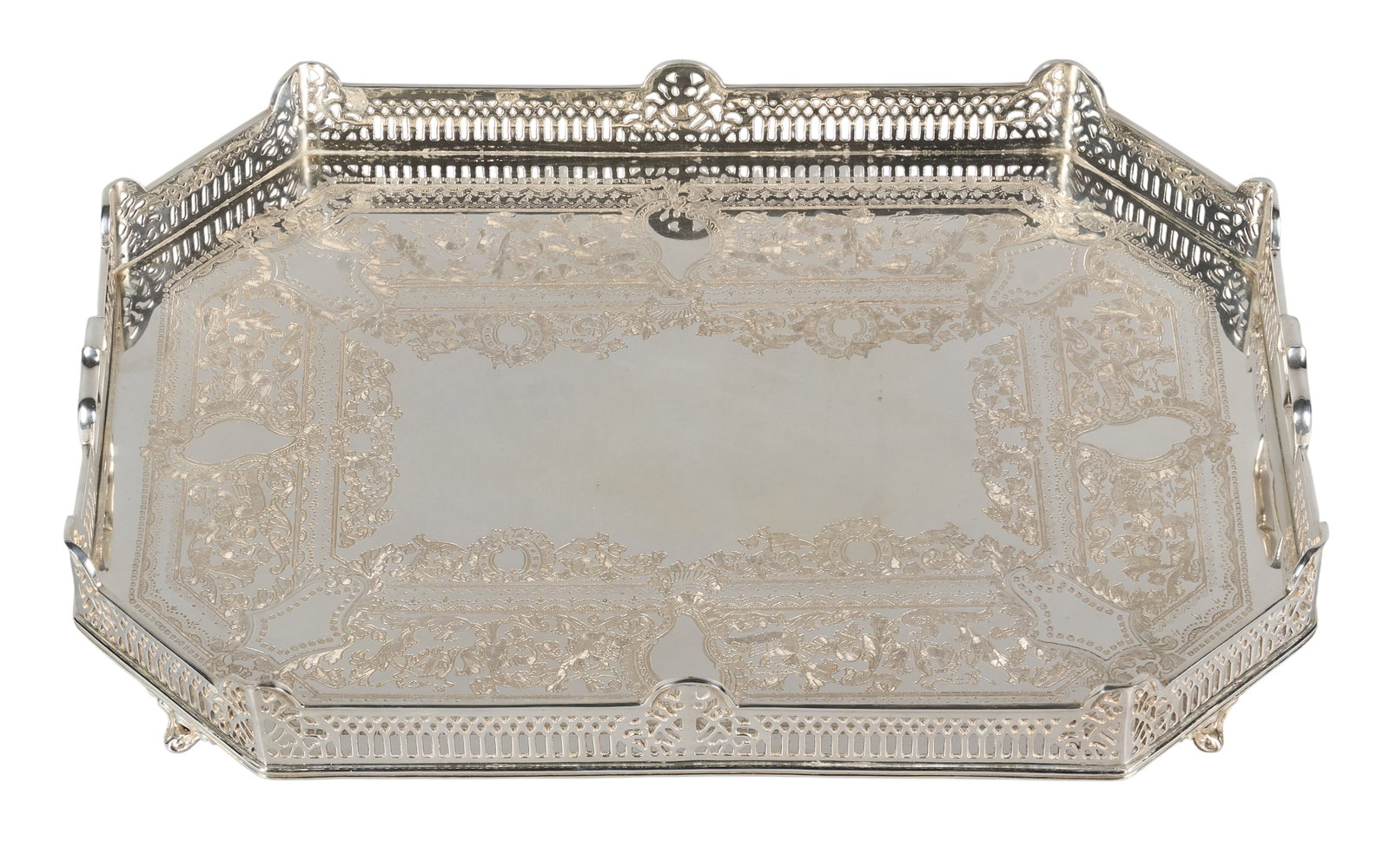 Red McCombs | Engraved Gallery Silverplate Service Tray: Silverplate gallery serving tray featuring a pierced openwork lattice gallery rim, with detailed floral and scroll etching, raised on scrolled feet height 4 in. x width 24 in. x depth 18&nbs