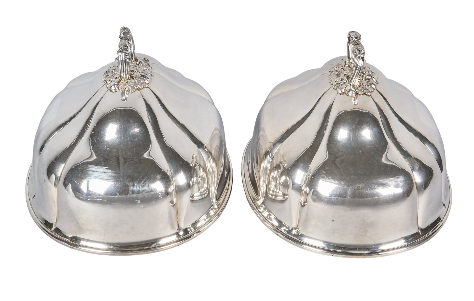 Red McCombs | Victorian Silverplate Domed Meat Covers: Pair of Victorian silverplate domed meat covers, with repousse foliate design to handles height 8.5 in. x width 15 in. x depth 9.5 in.