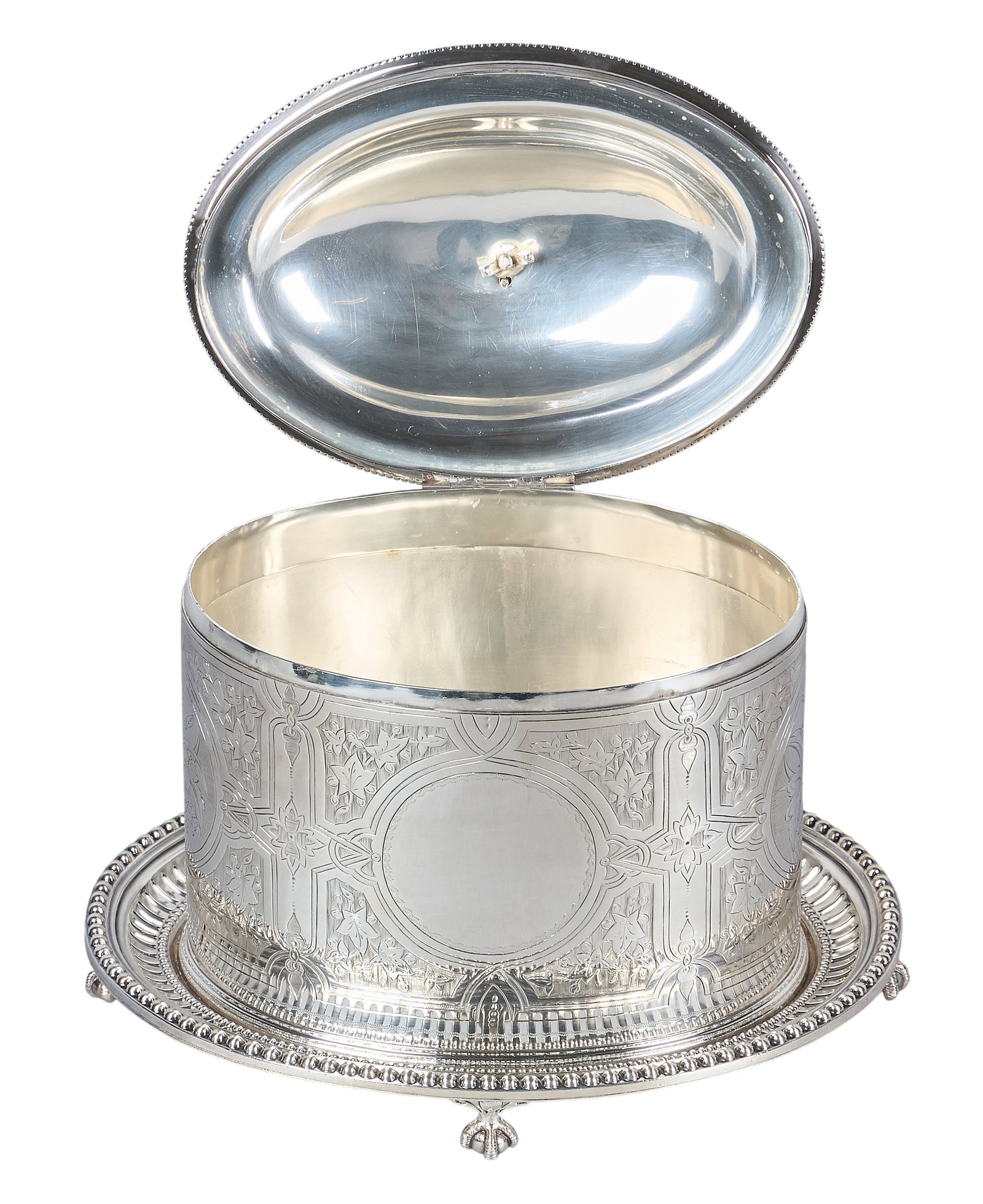 Red McCombs | Victorian Silverplate Biscuit Barrel: Victorian silverplate biscuit barrel, featuring hinged domed lid with lion's head finial, foliate embossed design to exterior, raised on ball and claw feet, hallmarked height 8 in. x width 9 in. x