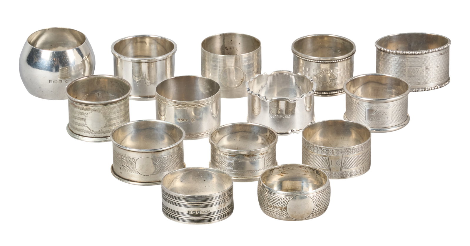 Red McCombs | (14) Antique English Sterling Silver Napkin Rings: Collection of fourteen antique sterling silver napkin rings, several with monograms and hallmarks height 1.5 in. x diameter 2 in. / largest Total weight: 10.5 ozt Provenance: Property from the pe