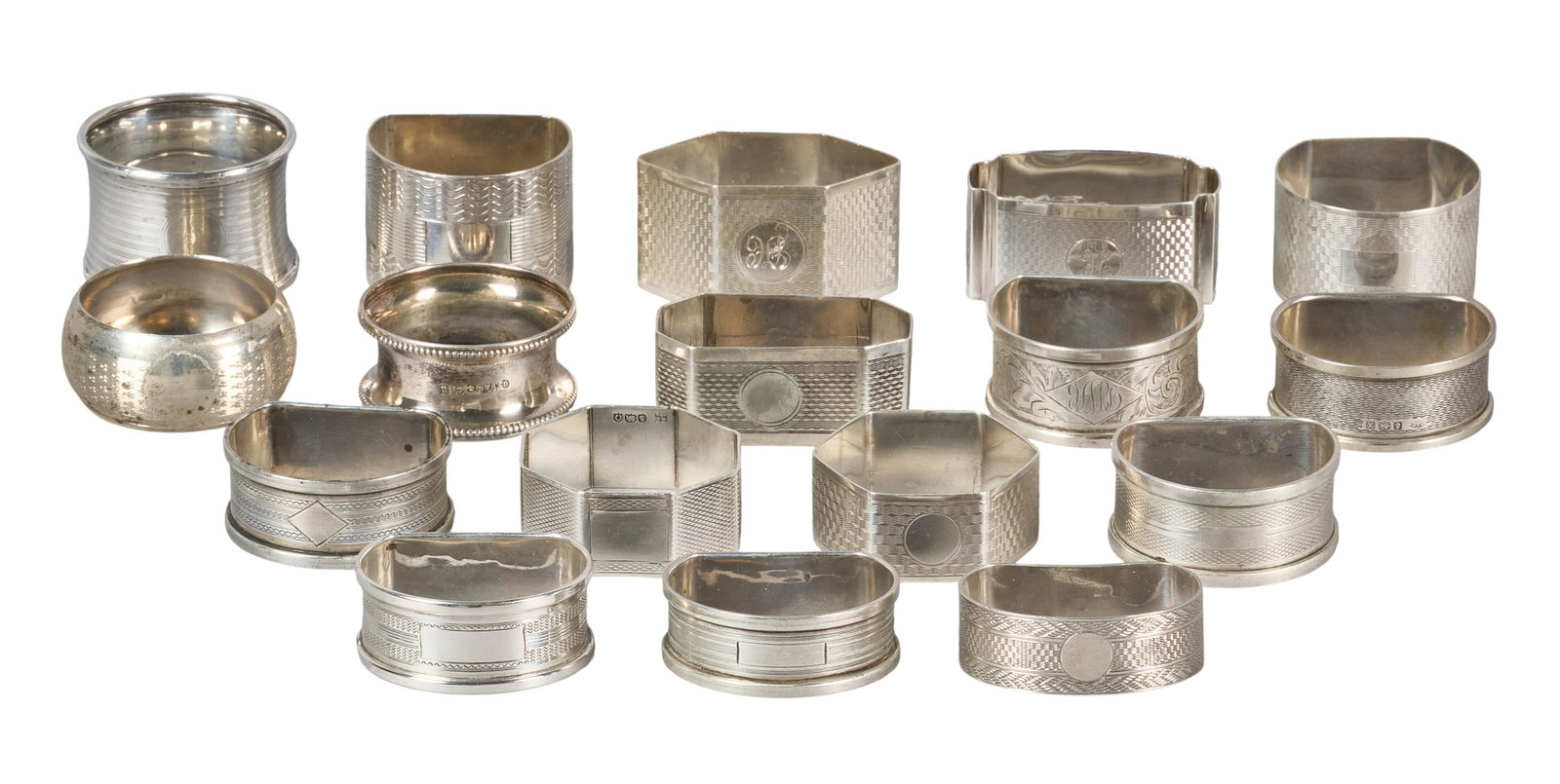 Red McCombs | (17) Antique English Sterling Silver Napkin Rings: Collection of seventeen antique sterling silver napkin rings, several with monograms and hallmarks height 1 in. x width 2 in. x depth 1 in. / largest Total weight: 9.5 ozt Provenance: Property