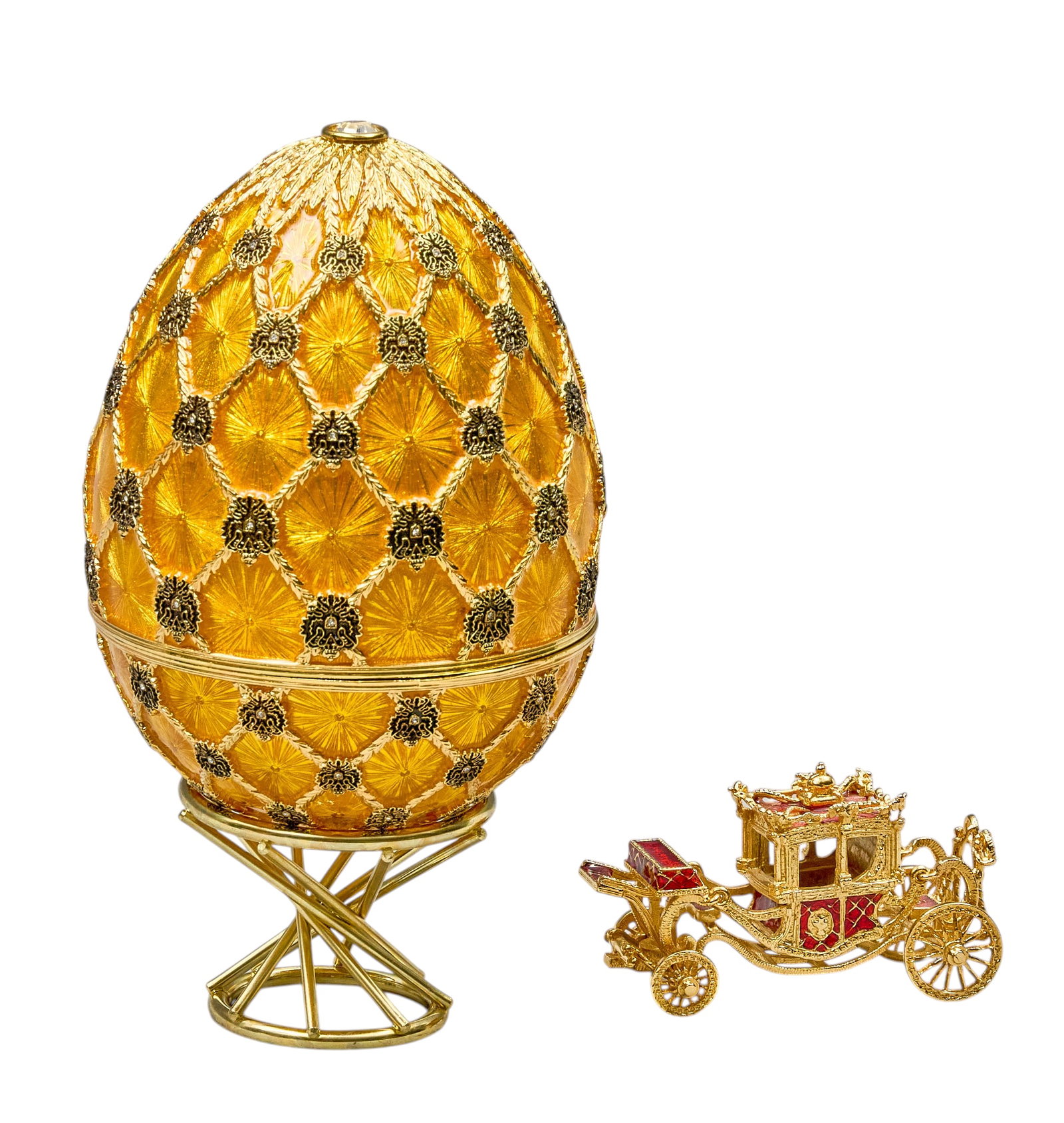 Red McCombs | Faberge Golden Imperial Coronation Egg: Faberge golden imperial coronation egg, Jean-Marie Reynaud reproduction, includes imperial carriage height 7 in. x width 4 in. x depth 4 in. Provenance: Property from the personal estate co