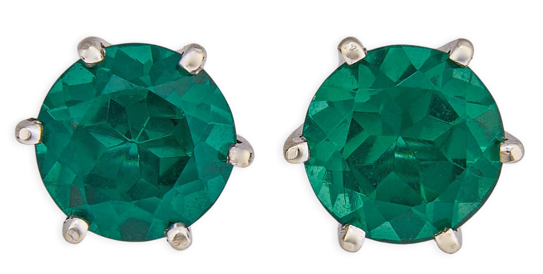 Red McCombs | 14K Green Topaz Stud Earrings: Pair of 14K white gold stud earrings set with round brilliant cut green topaz, approximately 2 ct each, with sterling silver backs Total weight: 2.6 g Provenance: Property from the personal 