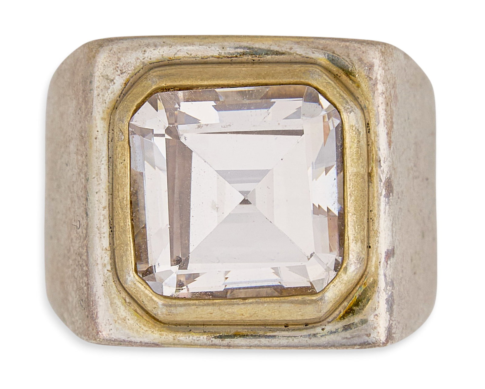 Red McCombs | Sterling Silver CZ Solitaire Ring: Sterling silver ring set with radiant-cut cubic zirconia in a gold-toned bezel setting Size: 6.5 Total weight: 13.4 g Provenanc