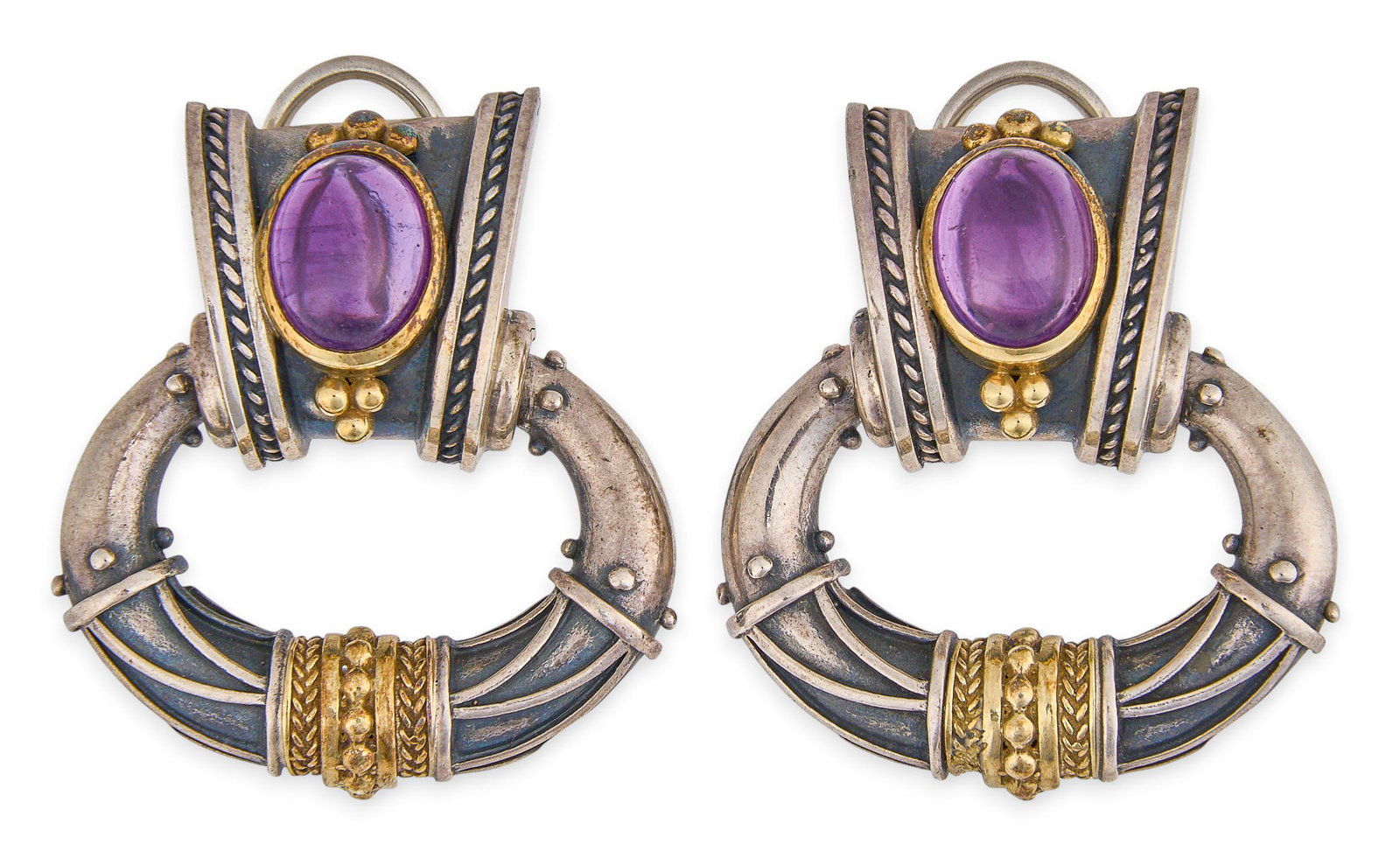 Red McCombs | Sterling/18K Amethyst Dangle Earrings: Pair of sterling silver drop earrings featuring bezel-set amethyst oval cabochons, with 18K yellow gold settings and details, marked "18K Sterling" Size: 1.25 x 1.25 in. / each Total weight: