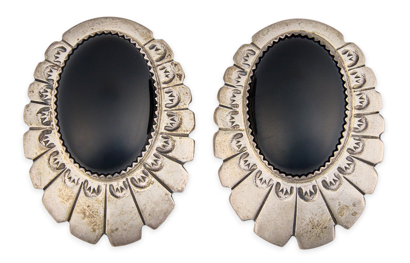 Red McCombs | Sterling Silver & Onyx Earrings: Pair of sterling silver earrings set with oval onyx cabochons and hand-stamped details, marked "LO Sterling" to reverse Size: 1.75 x 1.25 in. / each Total weight: 22.8 g Provenance: Pro