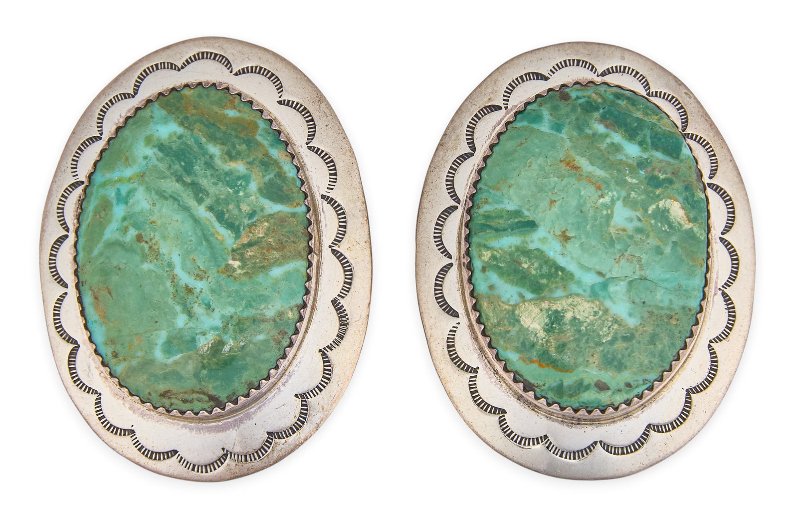 Red McCombs | Sterling Silver & Turquoise Earrings: Pair of sterling silver earrings set with oval turquoise cabochons and hand-stamped details, marked "Sterling T. Morgan" to reverse Size: 1.5 x 1.25 in. / each Total weight: 23.7 g Provenanc