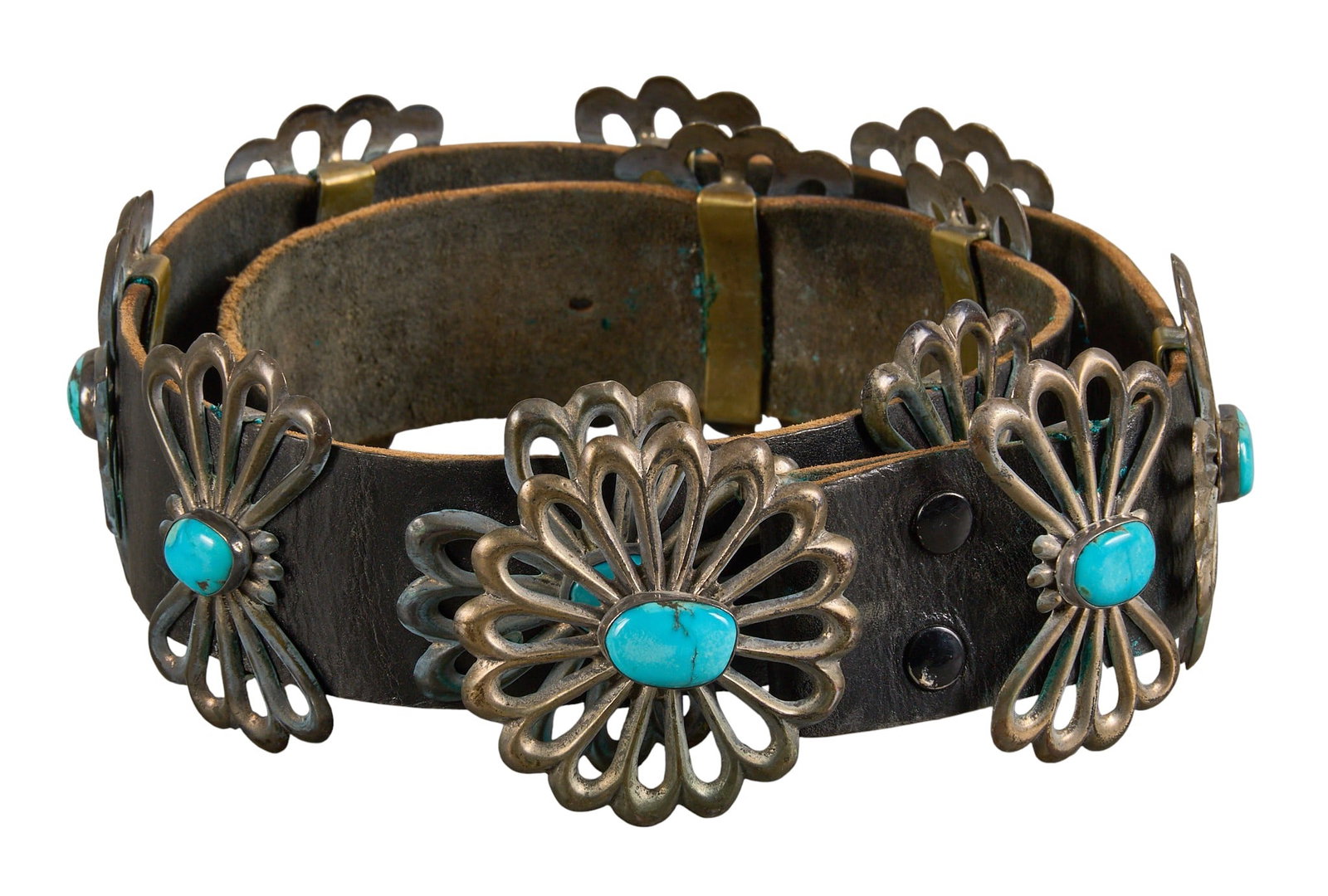 Red McCombs | Turquoise Sterling Silver Concho Belt: Turquoise sterling silver concho belt with eleven conchos and buckle on black leather belt, each set with turquoise stones Length: 35 in. Total weight: 17.36 ozt Condition B; good con