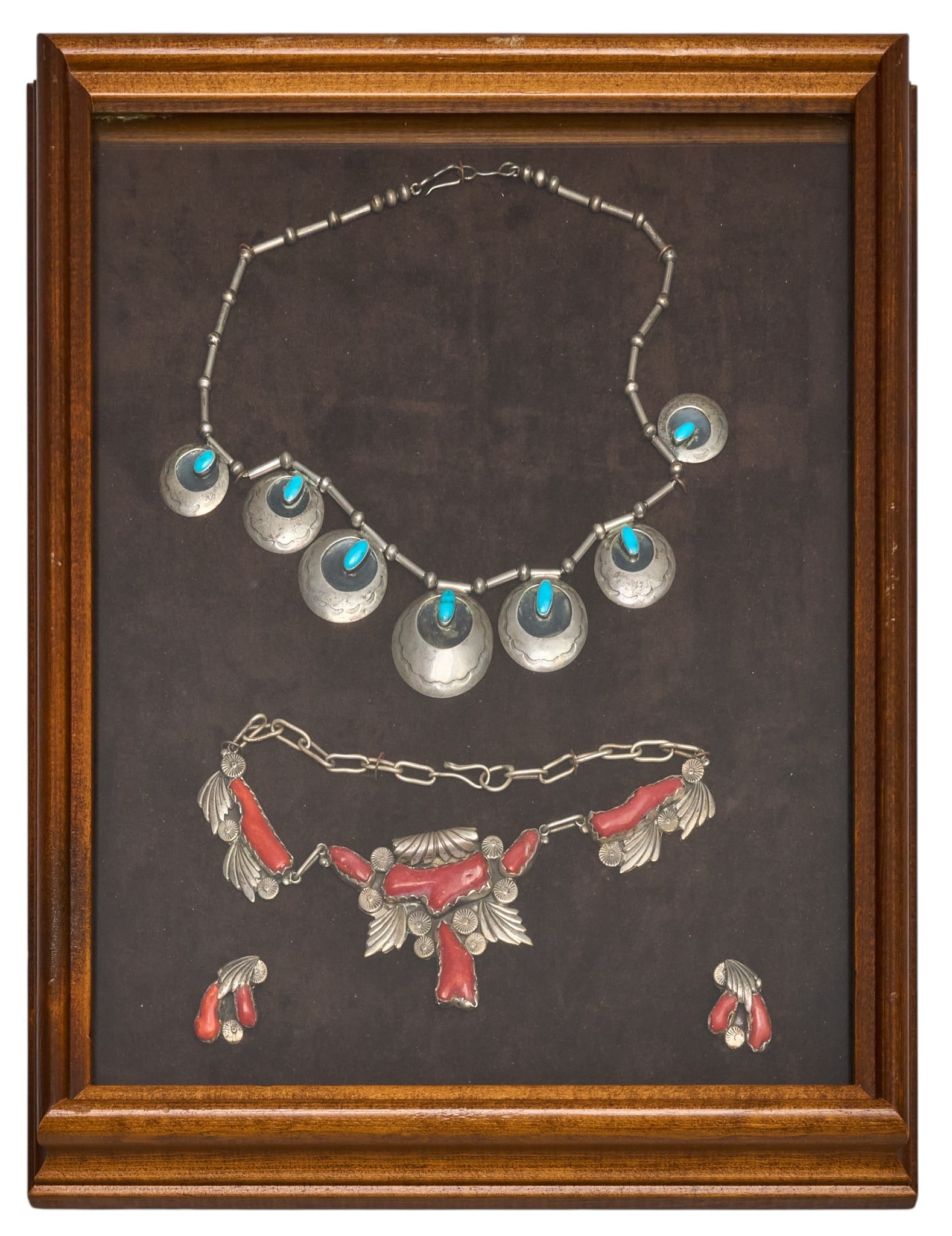 Red McCombs | Framed Southwestern Jewelry: Two pieces of Southwestern style jewelry presented in shadowbox case, includes one sterling silver necklace with concho-style dangles and bezel-set turquoise cabochons, and one matching set featuring 