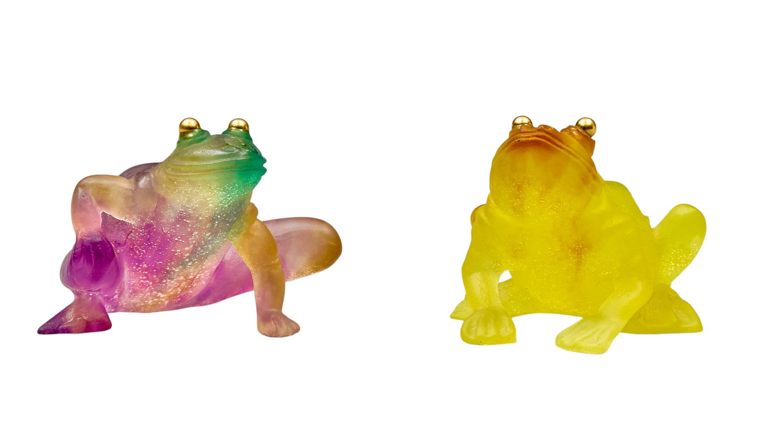 Red McCombs | (2) Daum Crystal Pâte-de-Verre Art Glass Frogs: Two Daum Crystal pâte-de-verre art glass frogs, with gradient design, and 18-karat gold eyes height 3 in. x width 4 in. x depth 3 in. / each Provenance: Property from the personal est