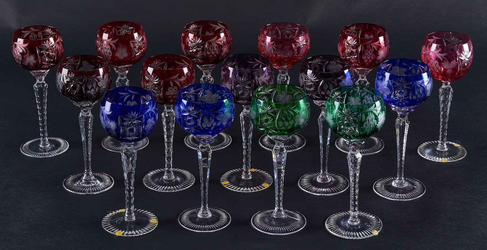 Red McCombs | Collection of (15) Cut-to-Clear Nachtmann Traube Hock Wine Glasses: Collection of fifteen cut-to-clear Nachtmann "Traube" hock wine glasses, in various colors height 8 in. Provenance: Property from the personal estate collection of iconic Texas bu