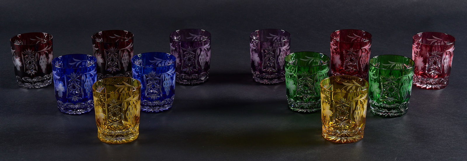 Red McCombs | Collection of (12) Cut-to-Clear Nachtmann Traube Old Fashioned Glasses: Collection of twelve cut-to-clear Nachtmann "Traube" old fashioned glasses, in various colors height 4 in. Provenance: Property from the personal estate collection of iconic Texas businessma